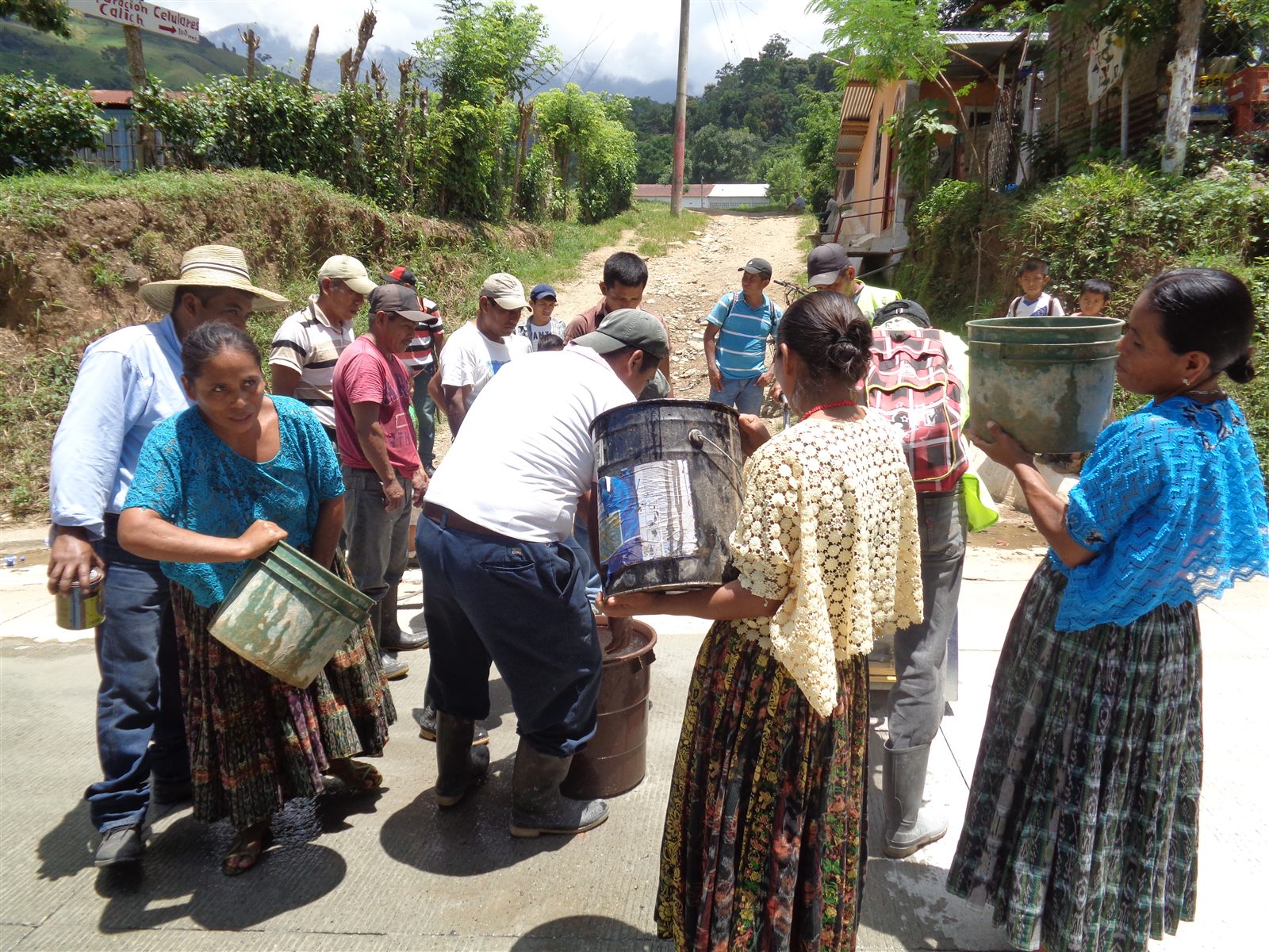 Community members participating together in a water activity supported by ADICAY