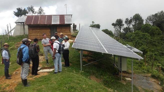 Community gathered near a solar-energy installation
